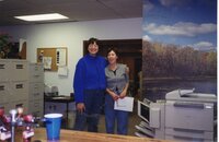 2001  NRCS Soil Conservationist Deb Nace and District Employee Margaret McLachlan stand for a photo in the office