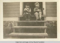 Vidie and Norm holding kittens