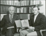 Earl Heady and Howard Madsen looking at CARD Report 39 that they authored together, 1972.