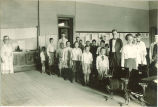 Children and adults in classroom, The University of Iowa, ca. 1920