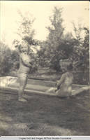 Vidie and Frindy Burden in swimsuits by the pool