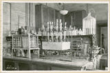 Chemical glassware on laboratory table, 1938