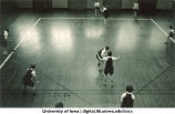 Softball game in a gymnasium, The University of Iowa, 1920s