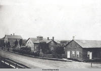 View of Moerschel Kitchen, shoe shop, and watch house on main street, Amana, Iowa, 1900s