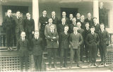 Men standing on porch, the University of Iowa, 1920s?