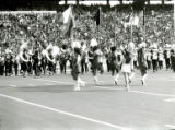 ISU Color Guard performing with the Marching Band for Homecoming, 1977