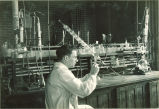 Chemist working in lab, The University of Iowa, 1930s?