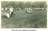Barrel rolling race in City Park as part of Senior Frolic, The University of Iowa, 1912