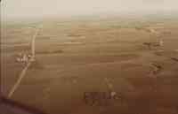 Unidentified color photo of farmland showing contouring