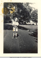 Vidie Burden in front of Barn and Chauffeur's house