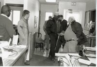 Six Unknown Men Stand in Office