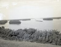 Barges being towed on river