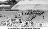 Governor's Day on Iowa Field, American flag in procession, The University of Iowa, May 22, 1926