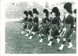 Scottish Highlanders practicing on football field, The University of Iowa, 1960s?