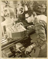 Arnold L. Swails milling magnesium blocks into containers for satellites and space probes, The University of Iowa, 1970