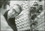 Two researchers work on a control panel, 1970