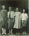 Children standing tallest to shortest, The University of Iowa, ca. 1920