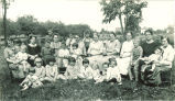 Staff and children sitting outside, The University of Iowa, 1920s