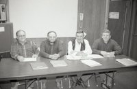 Four Men at a Meeting
