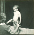 Measuring a child's waist, The University of Iowa, 1938
