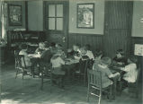 Children at classroom tables, The University of Iowa, 1920s