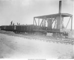 Men on railroad cars near Iowa Ballast and Construction Co., Maxon, Iowa, late 1890s or early 1900s