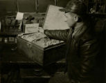 Instruction manuals for farm machinery in steel box, 1951