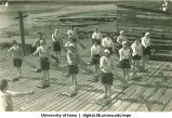 Land drill demonstrating straight draw recovery of paddle using a sharp forward downward cut, The University of Iowa, 1930s