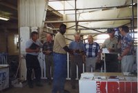 1998 District Conservationist J.B. Martin and  Jeff Bergman <br />
present award to Harold Linder at the Ag Expo