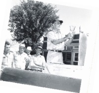 Tom Nielson with fish for stocking pond