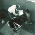 Students working at the astronomy observatory on the roof of the Physics Building, The University of Iowa, 1950s