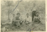 Group of men eating watermelon