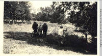 John Heitzman on haycutter with two men working