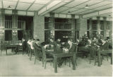 Students reading at tables in the Pharmacy library, The University of Iowa, 1930s