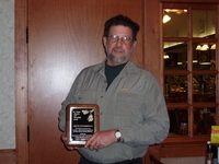 2005 Commissioner Todd Heckenberg presents Steve Nunnikhoven with the Gary Wagner Memorial Land Stewardship Award.