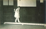 Small girl on a balance beam, The University of Iowa, 1930s