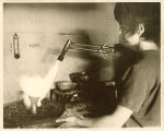 Art student firing a clay pot, The University of Iowa, 1970