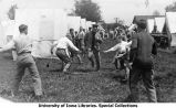 Cadet running the gauntlet at Camp Macbride, The University of Iowa, 1913