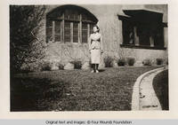 Arlene Friedlein in front of Grey house