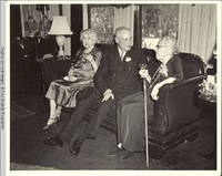 Cornelia, Bill and Viola sitting on couch in living room