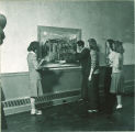 Students viewing painting, The University of Iowa, 1949