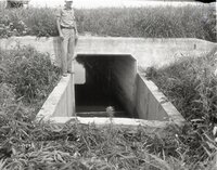 Man stands on watershed structure