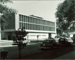 Automobiles parked by Communications Center, The University of Iowa, July 1953