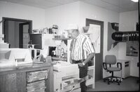 1995  John Horan stands at the photocopy machine