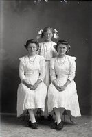 Three girls in white dresses
