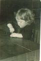 Small child playing with a string, The University of Iowa, 1920s