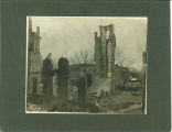 Crowd of people standing in Washington Street looking at the ruins of Medical Building after the fire, the University of Iowa, March 1901