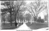 Pedestrians on Old Capitol sidewalk, The University of Iowa, 1900
