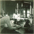 Student at work in pharmacy laboratory, The University of Iowa, 1930s