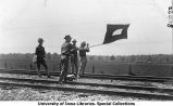 Men using semaphore signaling, The University of Iowa, 1913